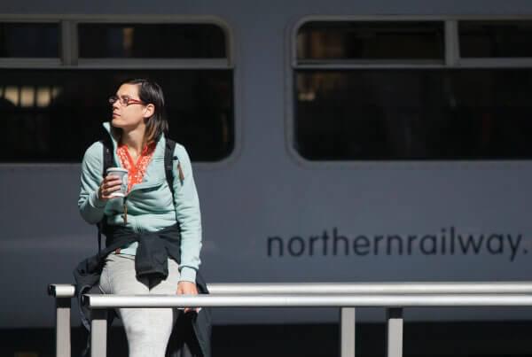 A commuter next to a train